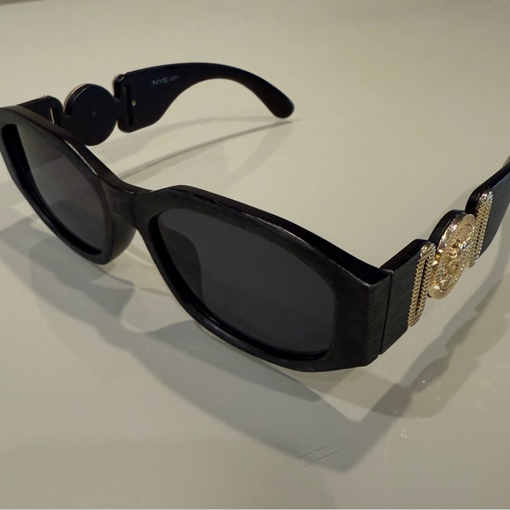 Elegant Black Sunglasses with Gold Detail